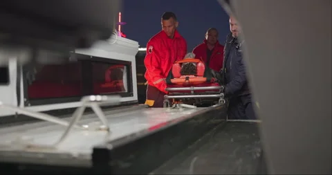 Ambulance, first aid and accident with a paramedic team on scene to rescue a Stock Footage 252644853