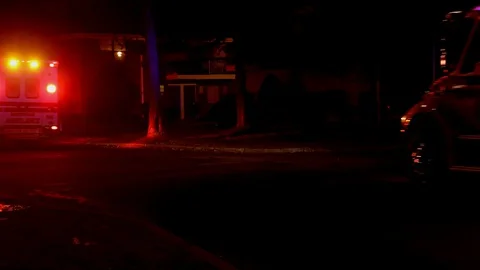 Ambulance flashes its lights during a paramedics with night city Video stock 129640328