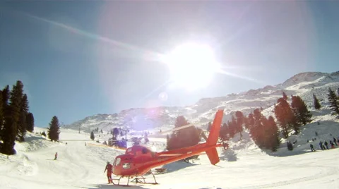 Ambulance helicopter starts engine on ski slope Stock Footage 45494142