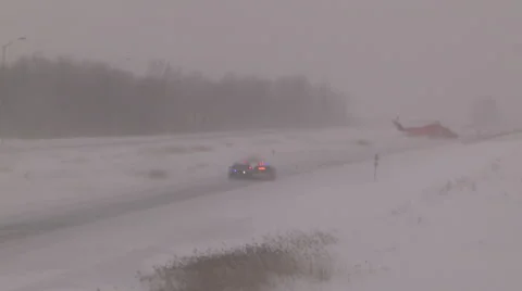 Ambulance helicopter stranded on highway in blizzard and snow squalls Stock Footage 46880456