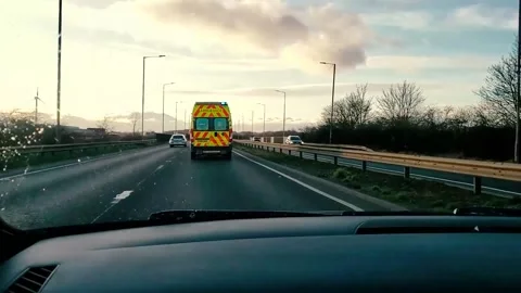 Ambulance on higway Stock Footage 230458856