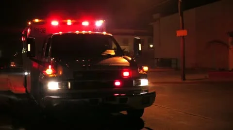 Ambulance illuminated in the dark Stock Footage