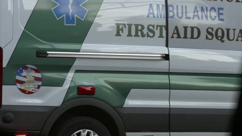 Ambulance Leaving Sidwalk 4K Stock Footage 145956435