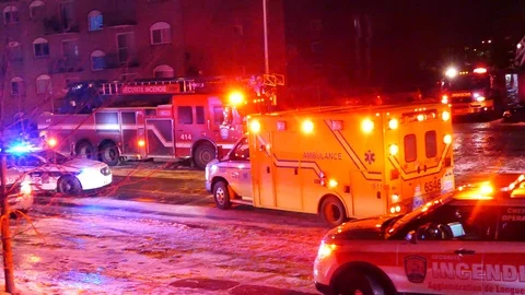 Ambulance leaving structure fire Stock Footage 104298426