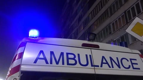 Ambulance lights flicker at night Stock Footage 127128514