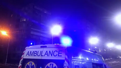 Ambulance lights flicker at night Stock Footage 127128703
