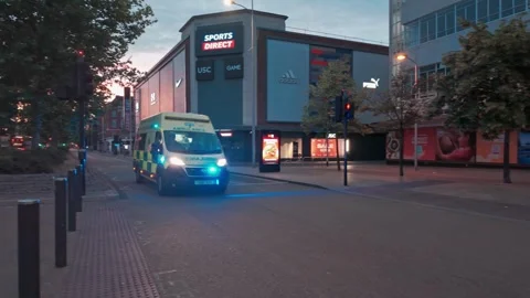 Ambulance at night, responding to emergency, flashing lights. Hull.UK. 2.6.2025 Stock Footage 337423907