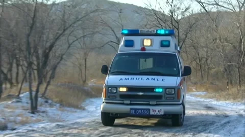 Ambulance passes on the road Stock Footage 253771564