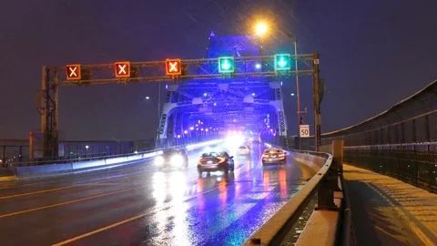 Ambulance passing under bridge with lights Stock Footage 125549309