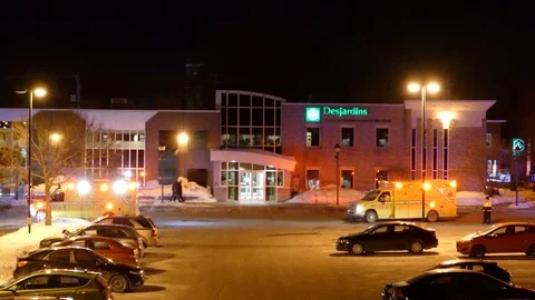 Ambulance pulling up at scene of a hostage taking at bank in North America Video stock 104515554