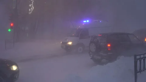 Ambulance rides through a blizzard Stock Footage 169528738