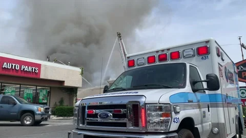 Ambulance on scene of fire Stock Footage 153444078