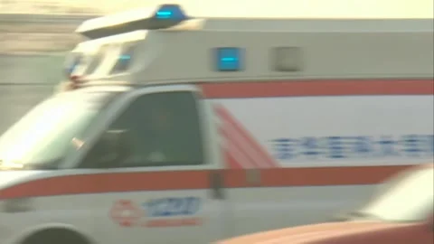 The ambulance speeds by Stock Footage 253771356