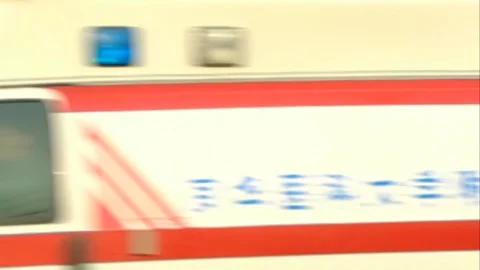 Ambulance speeds by Stock Footage 253771368
