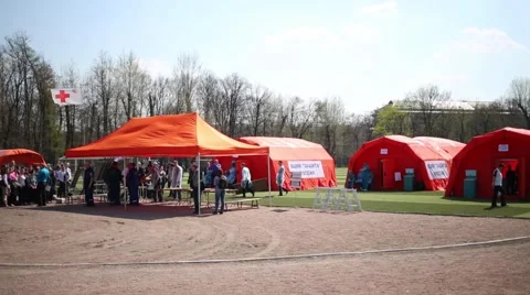 An ambulance stops at the in a multifunctional mobile hospital Stock Footage 65183288