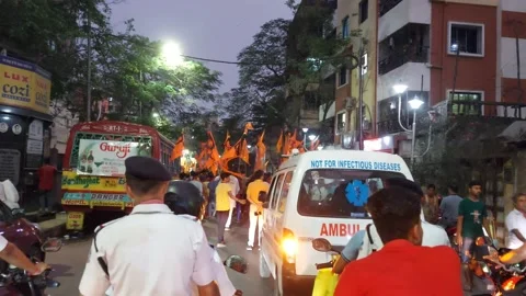 The ambulance is stuck in the religious procession. Stock Footage 181363971
