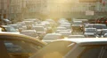 Ambulance in traffic jam city stuck street, dusk sunlight rays HD Footage