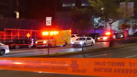Ambulance trying to pass traffic at night Stock Footage 99848190