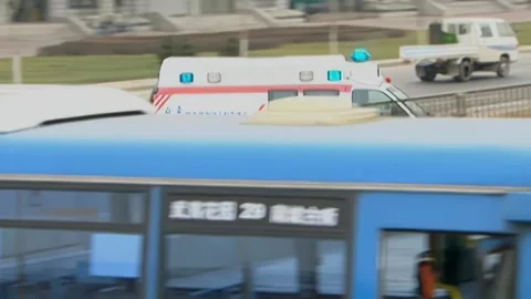 Ambulance turns a corner Stock Footage 253771428