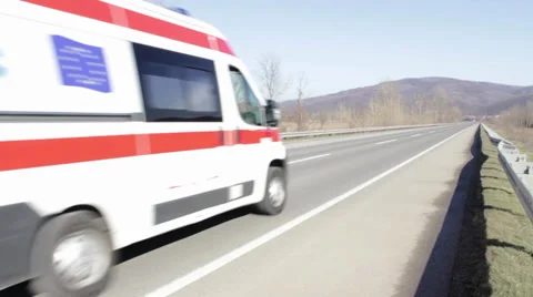 Ambulance van going at high speed on a transit route. Ambulance on the open road 스톡 동영상 35414199