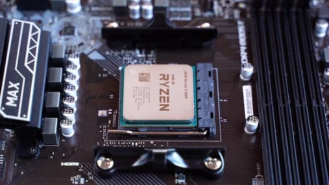 AMD Ryzen 3600 processor in the B450 motherboard socket Stock Footage 121053530