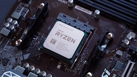 AMD Ryzen 3600 processor in the B450 motherboard socket Stock Footage 121053840