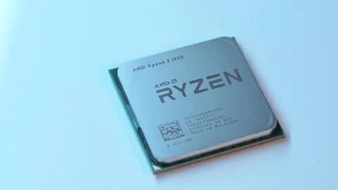AMD Ryzen 5 1600 AM4 computer processor on a table Stock Footage 236472080
