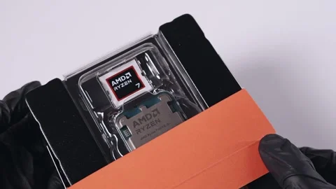 AMD Ryzen 7 9800X3D processor in retail packaging with visible CPU Stock Footage 294796566
