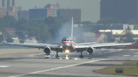 American AA airlines jet airplane touchdown arrival runway laguardia Stock Footage