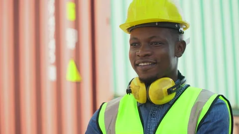 American African container worker confident and smiling standing at warehou.. Stock Footage 241715025