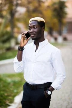 American african man using mobile in the street. Communication concept. Foto stock
