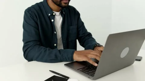 American afro user hands typing on laptop keyboard,mixed race ethnic businessman Video stock 179957282