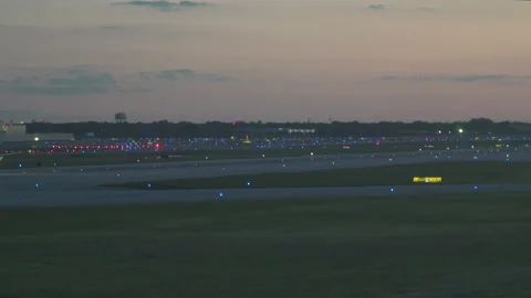 An American Airlines jet rolls down the runway during takeoff at Chicago Stock Footage 201111715
