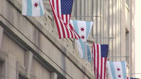 American and Chicago Flags Flying - Downtown Chicago Stock Footage 135613553
