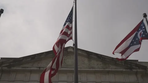 American and Ohio State Flags in front of Ohio Statehouse Video stock 148693979