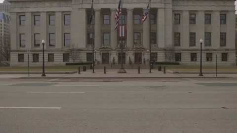 American and Ohio State Flags in front of Ohio Statehouse Stock Footage 148694059