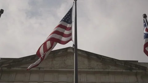 American and Ohio State Flags in front of Ohio Statehouse Stock Footage 148694248