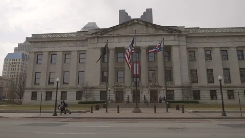 American and Ohio State Flags in front of Ohio Statehouse Stock-Footage 148694330