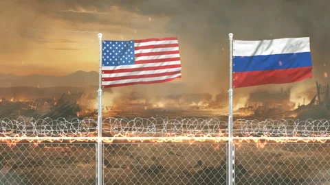 American and Russian flags waving in front of a war torn landscape with bur.. Stockbeeldmateriaal 341618376