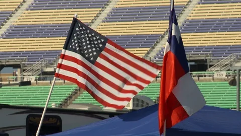 American and Texas Flags in Stadium Stock Footage 95566366