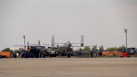 American B-25 Mitchell bomber steers into parking lot after landing. Close-up. Stock Footage 118896807