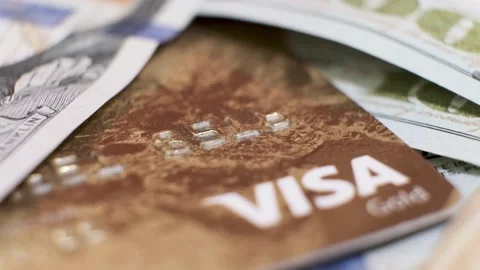 American Banknotes Dollars and Plastic Credit Card Visa on Rotating Table. Stock Footage 139607488