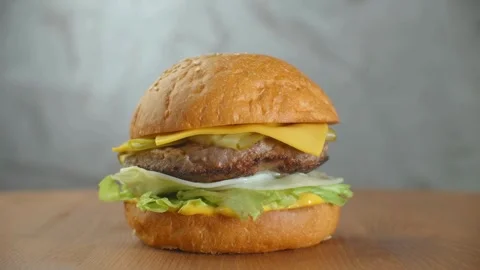 American beef burger with lettuce, burger served with french fries and tomato Video stock 336579291