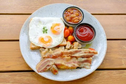 American breakfast with eggs, bread,bacon  on the table Stock Photos