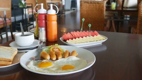 American breakfast with sunny side up eggs, toast Stock-Footage 79250843