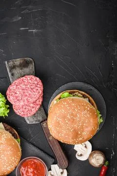 American burger components on black background, flat lay with copy space Stock Photos