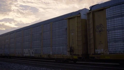 American Cargo Train at Sunset Slow Motion Stock Footage 78894231
