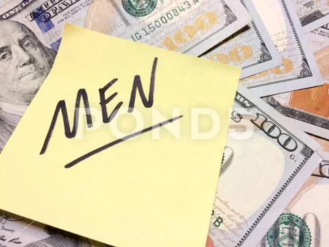 American cash money and yellow sticky note with text Men Stock-Fotos
