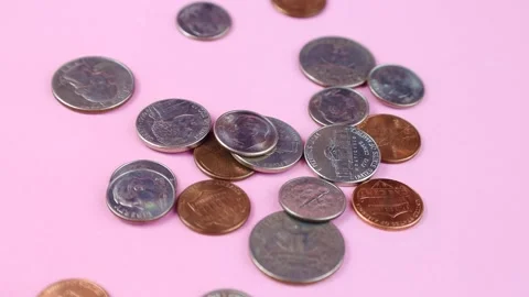 American cent coins falling down on pink background close up Stock Footage 243560436