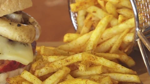 American cheeseburger with cheese, beef, tomato, lettuce and mushrooms Stock Footage 80262049